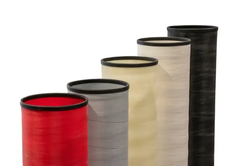 Anilox roll covers come in a variety of colors for easy categorization of rolls.