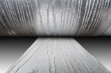 Embossing rolls for wood-grain patterns in decking, siding, and garage door manufacturing.